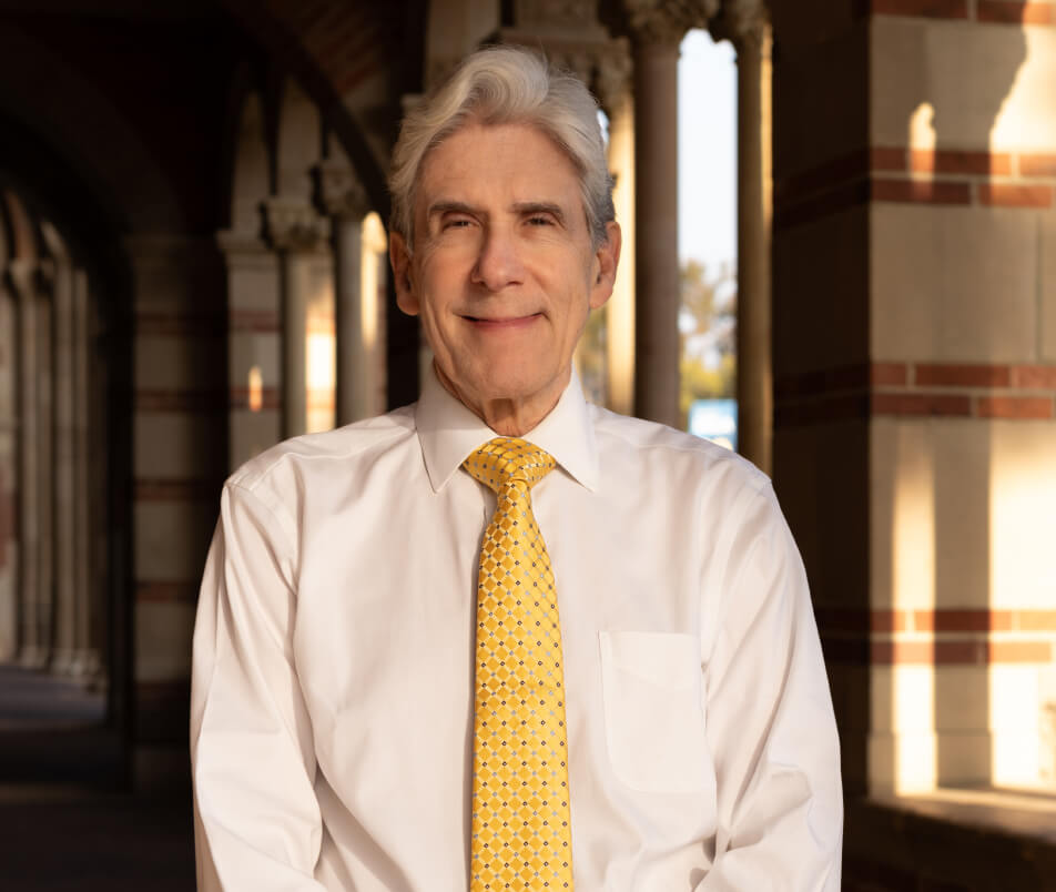 Julio Frenk wearing a yellow tie.