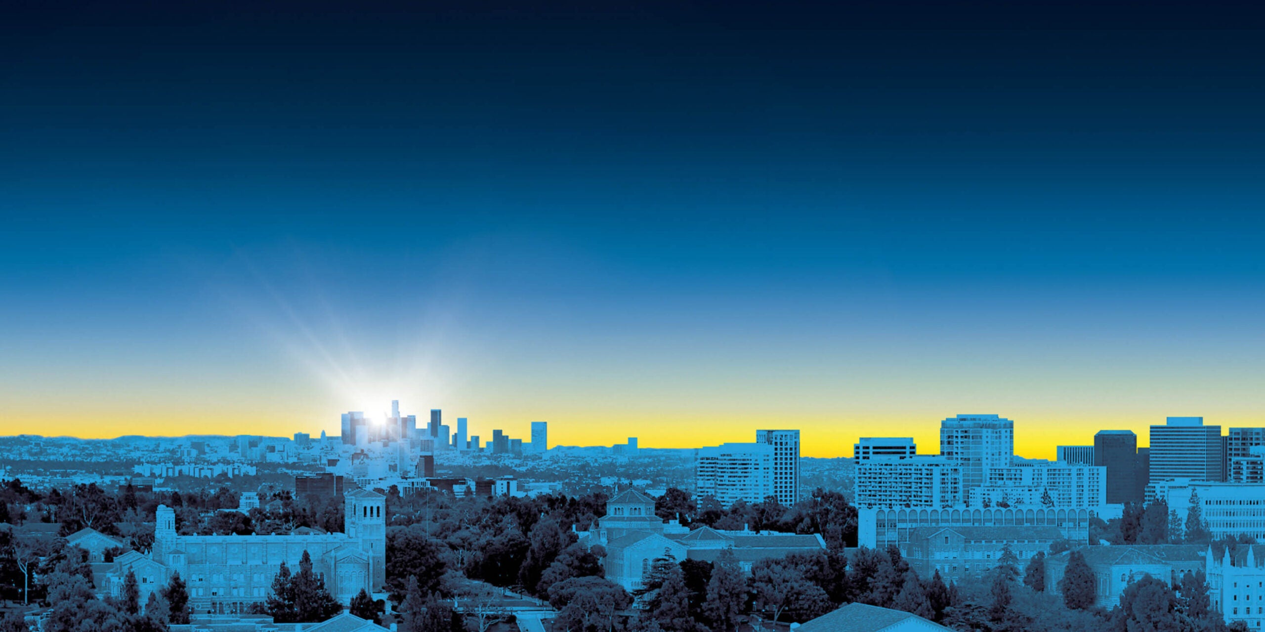 A stylized view of the Los Angeles skyline featuring a dramatic color gradient transitioning from deep blue to bright yellow at the horizon.