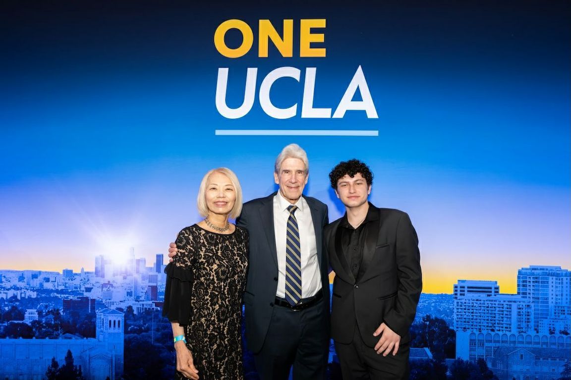 Chancellor Julio Frenk (center), poses with Mayu Sasame (left) and August Maturo — among the oldest and youngest UCLA graduates this year.