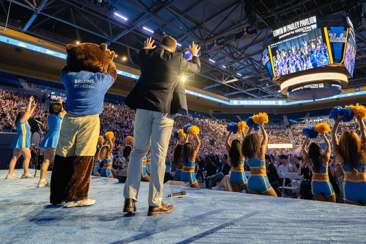 Charlie Kratus, Joe Bruin and the UCLA Spirit Squad members lead a packed Pauley Pavilion crowd in the eight-clap during New Student Welcome